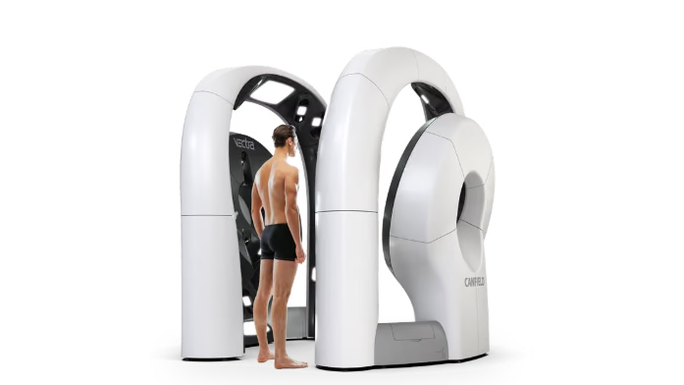 The VECTRA WB360 whole-body 3D imaging system with a patient standing in front of it